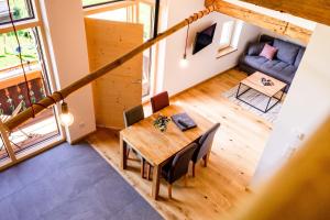 an overhead view of a dining room with a table and chairs at Biobauernhof Jagglhof in Saalfelden am Steinernen Meer
