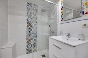a white bathroom with a sink and a shower at CB Living - Apartment with roof terrace Aguamarina in Orihuela Costa