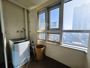 a bathroom with a water heater and a window at W Residence Hotel in Busan +60 photos