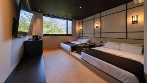 Ένα ή περισσότερα κρεβάτια σε δωμάτιο στο Mitasuya Ryokan Hotel Gongju Donghaksa Temple by Aank +117 φωτογραφίες