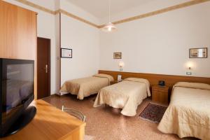 Postel nebo postele na pokoji v ubytování Parking Hotel Giardino