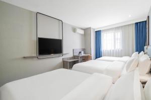 Μια τηλεόραση ή/και κέντρο ψυχαγωγίας στο 7 Days Inn Tianjin Railway Station