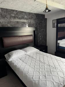 Ένα ή περισσότερα κρεβάτια σε δωμάτιο στο El Hostalito Metepec