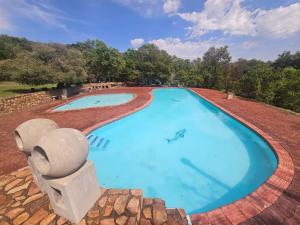 an overhead view of a large swimming pool at Amanda's Retreat in Buffelspoort