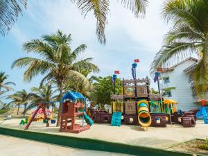 a playground with a slide and a play equipment at Hotel Las Americas Casa de Playa in Cartagena de Indias