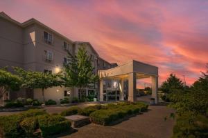 a rendering of a building with a sunset at Comfort Inn Federal Way - Seattle in Federal Way