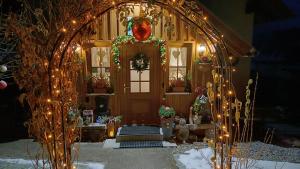 an archway with christmas lights in front of a house at Haus Hepi in Obertraun