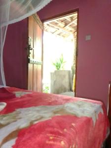 Ένα ή περισσότερα κρεβάτια σε δωμάτιο στο kapi wild cottage Ella