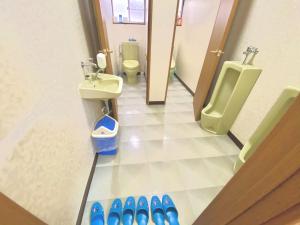 a bathroom with a urinal and a toilet and a sink at Yuzawa Toyo - Vacation STAY 98053 in Yuzawa +23 photos