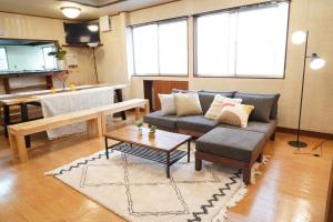 a living room with a couch and a table at Yuzawa Toyo - Vacation STAY 98053 in Yuzawa