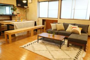 a living room with a couch and a table at Yuzawa Toyo - Vacation STAY 98053 in Yuzawa
