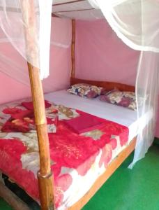 Ένα ή περισσότερα κρεβάτια σε δωμάτιο στο kapi wild cottage Ella