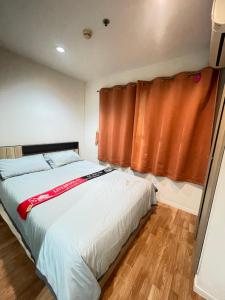 a bedroom with a bed and a window at Lumpini nawamin in Ban Bang Toei (1) +11 photos