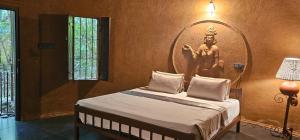 Una cama o camas en una habitación de Sigiriya Wild Cottages