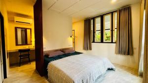 Ένα ή περισσότερα κρεβάτια σε δωμάτιο στο BamBelle Forest