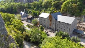 an aerial view of a building in the mountains at Rock Mill 1 Bed Apartment 36 in Stony Middleton