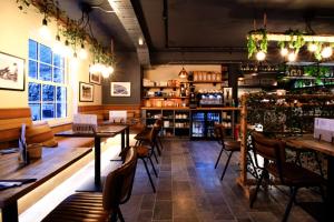 a restaurant with tables and chairs and a bar at Rock Mill 1 Bed Apartment 36 in Stony Middleton