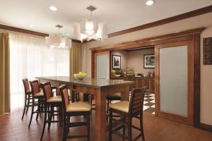 a kitchen and dining room with a table and chairs at Comfort Inn & Suites Portland - Corpus Christi in Portland