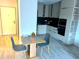 Kuchyň nebo kuchyňský kout v ubytování Moderné ubytovanie v Senici + 7 fotografií
