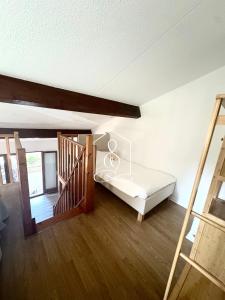 Ένα ή περισσότερα κρεβάτια σε δωμάτιο στο La Petite Provence, résidence avec piscine