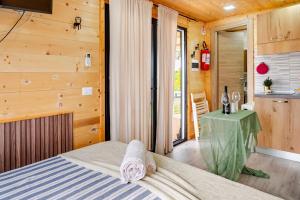 Ένα ή περισσότερα κρεβάτια σε δωμάτιο στο Minicasa La Barca