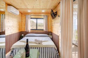 Ένα ή περισσότερα κρεβάτια σε δωμάτιο στο Minicasa La Barca +13 φωτογραφίες