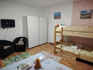 a small room with two bunk beds and a couch at Apartman Raj in Vrnjačka Banja +34 photos