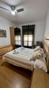 a bedroom with a large bed with a ceiling at Galteo Remedios in Ronda