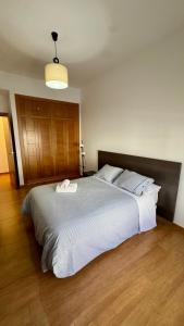 a bedroom with a large bed with two towels on it at Galteo Remedios in Ronda +7 photos