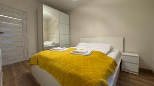 Ένα ή περισσότερα κρεβάτια σε δωμάτιο στο Tabago Studio 41 Skierniewice Reymonta