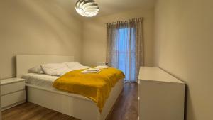 Ένα ή περισσότερα κρεβάτια σε δωμάτιο στο Tabago Studio 41 Skierniewice Reymonta +2 φωτογραφίες