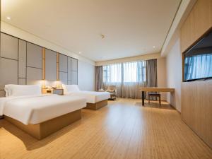 Giường trong phòng chung tại JI Hotel Chengdu Shuangliu Airport +30 ảnh