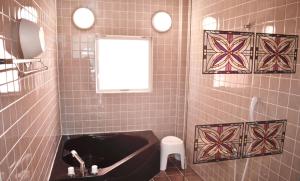 Et badeværelse på 恩納Garden Resort Okinawa