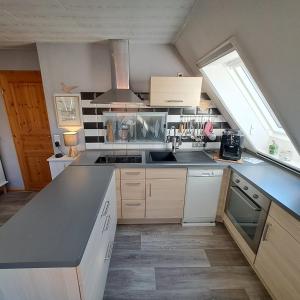 Η κουζίνα ή μικρή κουζίνα στο Ferienwohnung mit Treeneblick