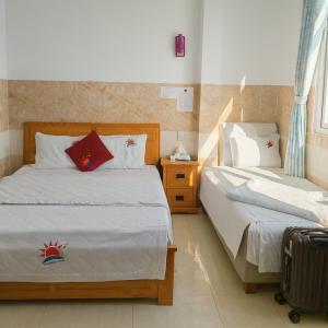 Ένα ή περισσότερα κρεβάτια σε δωμάτιο στο Thái Dương Hotel +15 φωτογραφίες
