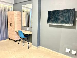 a dining room with a table and a mirror at Bayside Self Catering and Hotel 14 Monty Naicker Pinestreet Durban in Durban