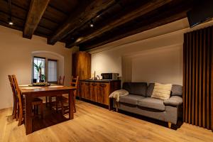 a living room with a couch and a table at ALBERT RESIDENCE City Center Accommodation Brașov in Braşov