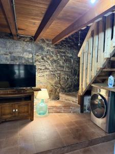 TV a/nebo společenská místnost v ubytování La aldea de lug