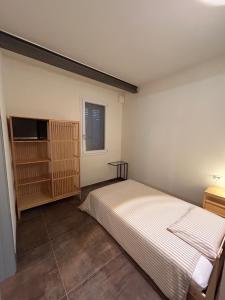 Ένα ή περισσότερα κρεβάτια σε δωμάτιο στο Emilia94