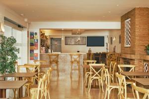 TV a/nebo společenská místnost v ubytování Hotel Villa Flamenca