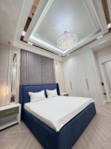 Postel nebo postele na pokoji v ubytování Tashkent city Gardens Scenery