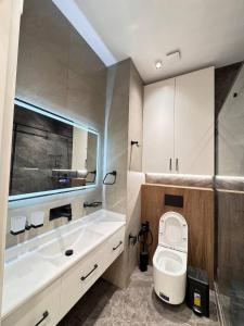 Koupelna v ubytování Tashkent city Gardens Scenery