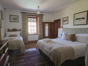 Ένα ή περισσότερα κρεβάτια σε δωμάτιο στο Swartvlei Guest Farm +124 φωτογραφίες