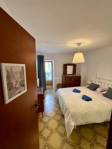 Ένα ή περισσότερα κρεβάτια σε δωμάτιο στο Casa Altolaterra
