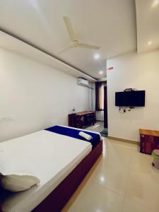 TV a/nebo společenská místnost v ubytování Metro Residency