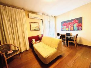 a living room with a couch and a table at Residence La Fenice in Padova