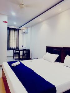 Postel nebo postele na pokoji v ubytování Metro Residency