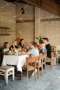 a group of people sitting at a table eating at Chalupa Morava in Veselí nad Moravou +43 photos