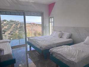 Postel nebo postele na pokoji v ubytování שושנת מטולה + 12 fotografií