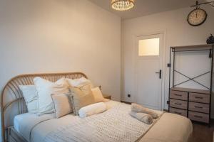 Ένα ή περισσότερα κρεβάτια σε δωμάτιο στο Nouveau sur dunkerque LE NID DU BEFFROI